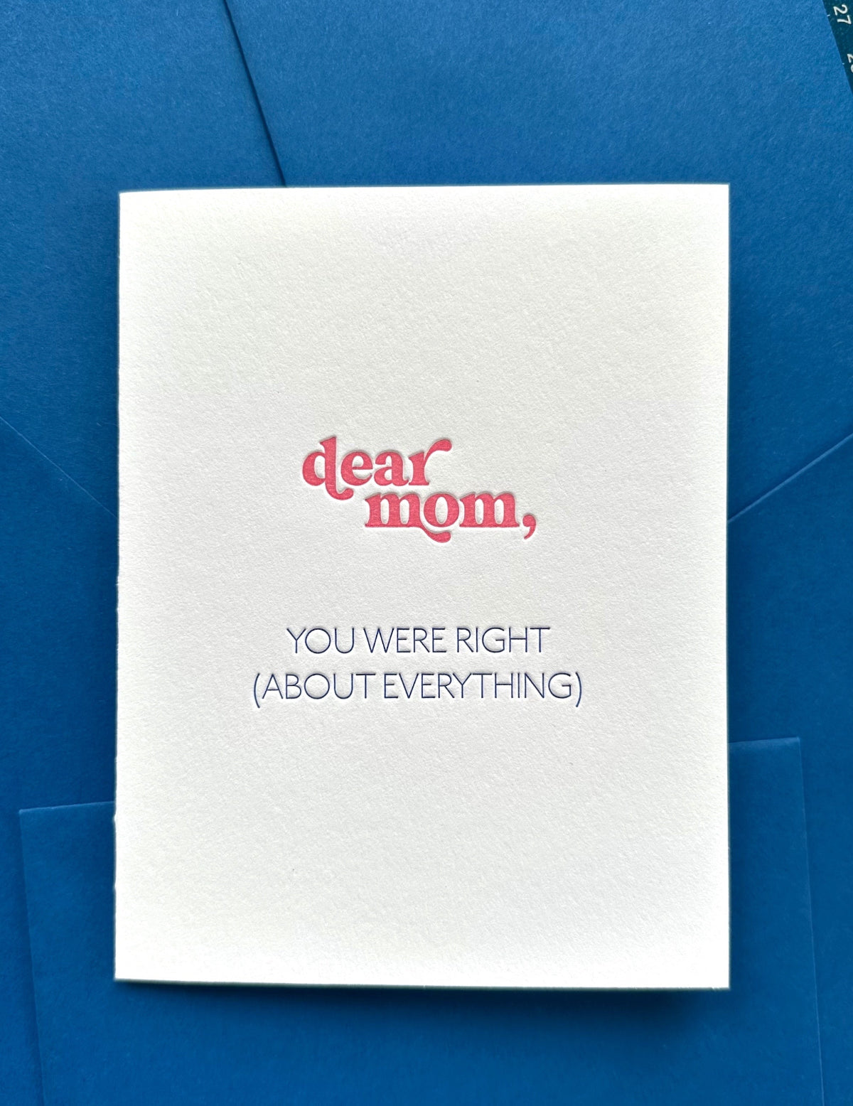 A greeting card with 'dear mom, you were right' printed in strawberry pink, sent from daughter, with a coordinating envelope.