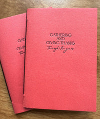 Thanksgiving memory journal shown at an angle, featuring coppery-persimmon handmade paper cover and letterpress chocolate ink lettering