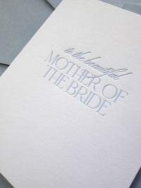 Close up of a letterpress card "To the Beautiful Mother of the Bride" for weddings.