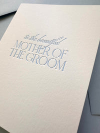 A wedding card to "the beautiful Mother of the Groom" in sky blue letterpress and matching envelope. 