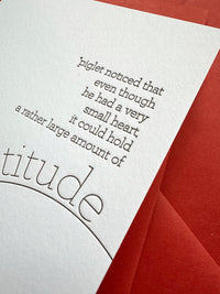 Close-up of letterpress text featuring Piglet gratitude quote in chocolate ink on bright white cotton cardstock