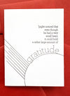 Letterpress greeting card with Piglet gratitude quote in chocolate ink on bright white cotton cardstock, paired with a persimmon-colored envelope
