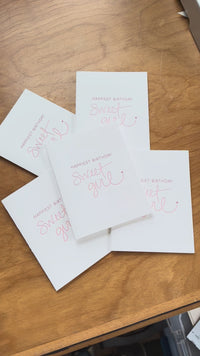Video of folding card with a sweet message saying "Happiest Birthday Sweet Girl" with a tiny heart. 