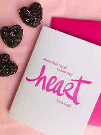 Humorous letterpress card for Valentine's Day, a wedding or anniversary saying, "Does this card make my heart look big?" featuring unique hand lettering. 